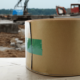 Roll of tan paper colored butyl sealant on a construction site