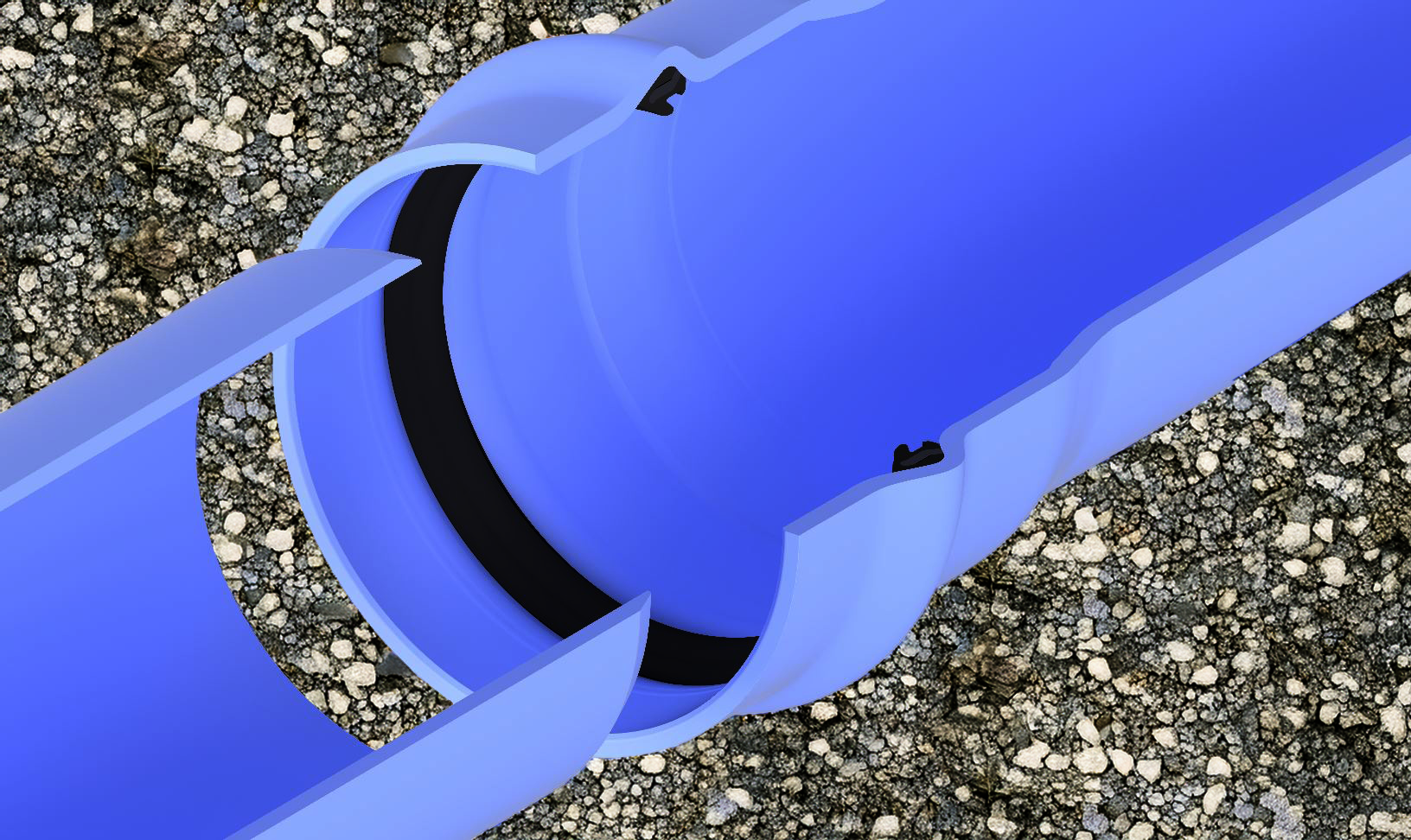 Blue colored plastic pipe laying on a bed of gravel